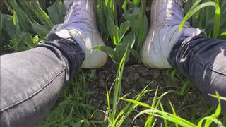 Well worn Nike AirForce 1 (AF1) destroy flowers, walk, crush and stomp in tulip field