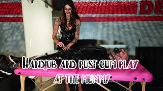 Handjob and post cum play at the mummy