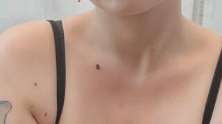 Smoking outside in a black top