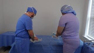 Doctor Nick and Doctor Jess tease each other in the clinic