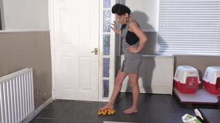 Katie Stepping On Oranges With Her Bare Feet
