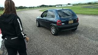 Miaisbeth cranking and starting her Chevy Corsa