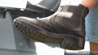 Standing next to her dirty rocking boot and smelling the leather