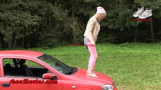 A girl walks barefoot on an Opel car (0013 part2)