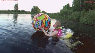 Alla swims in an inflatable ring and wears an inflatable vest and deflates a beach ball naked!!!