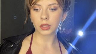 smoking white cigarette in leather jacket