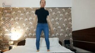 Jumping in the hotel's bed