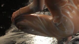 Sexy brunette girl in milk