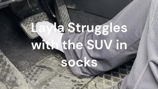 Layla Struggles with the SUV in bare socked feet