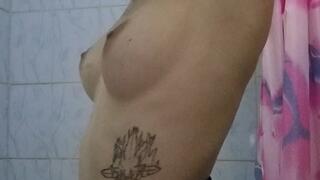 Carina sniffs her armpits