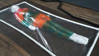 Mummification with multicolored stretch wrap in a transparent vacuum bed with vibro and orgasms