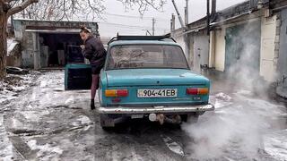 Nastya warms up an old car