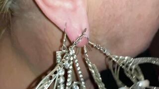 Many heavy earrings on one earlobe WMV