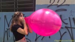 Katie Blows to Pop a Pink Tuf-Tex 17"