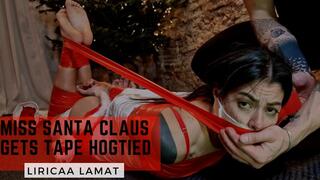 Miss Santa Claus gets tape hogtied