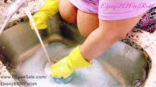 BBW cleaning and scrubbing her kitchen sink