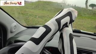 Lady S driving bored in boots and pantyhose
