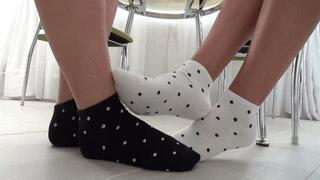 footsie in socks and wiggling toes So