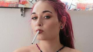 Smoking in a small bikini top,