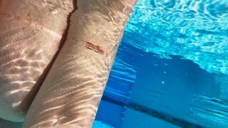 Topless Mermaid in the pool at the Resort