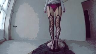 I'm standing on his head in fishnet tights, it's very sexy, don't you agree?