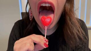 Mistress Alina Crunches on Heart-Shaped Lollipop