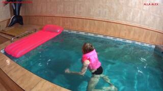 Alla wears a pink inflatable vest and rides hotly on a pink inflatable mattress in the pool!!!