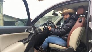 Pedal pumping of a real cowgirl with hat and cowboy boots