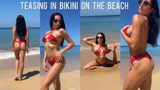 Teasing in bikini on the beach