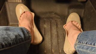 Fifi pedal pumping in sedan wearing shiny nude ballet flats and blue jeans
