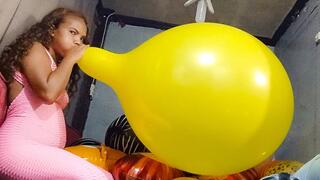 Sexy Juju Sensually Blows To Pop a HUGE Yellow 24 Inch Tuftex Balloon In A Pink Jumper