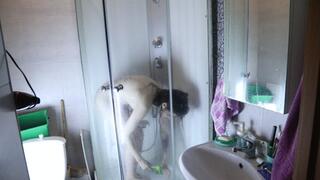 A caresses herself in the shower