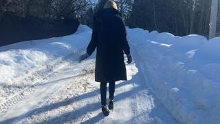 girl was walking along an icy mountain in very high heels and fell, severely injuring her leg