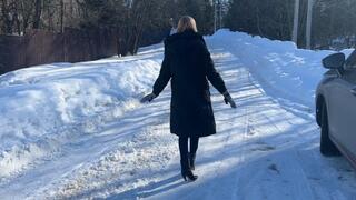 girl in leather boots walks on the ice and slips heavily, periodically falling