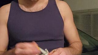 Hot guy smoking a cigarette in a tank top and popping balloons