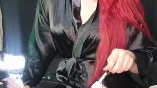 Smoking 100s in a satin robe on the bed