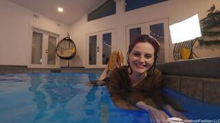 Petra swims with YOU wearing a long skirt and a brown top