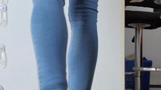 Skintight blue jeans piss