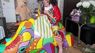 clown ride on rhino inflatable and play with foil balloons