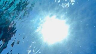 Underwater view from below with self-touch and bubbles in face and on chest