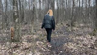 girl in high-heeled shoes and stockings walks first through puddles, then through mud, takes off her dirty shoes and tramples them into the ground