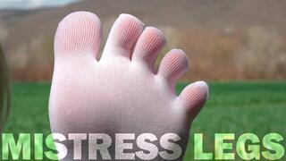 Goddess Feet in cute white socks with jeans on the spring grass field (MP4 HD)