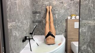 Stands legs, holding breathing and screaming underwater in a milk bath (custom video)