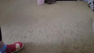 Vacuuming the floor in leggings, Birkenstock, socks