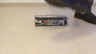 Worker stomping Toy Bus