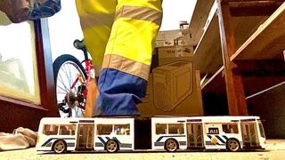 Garbageman crushing a Toy Bus