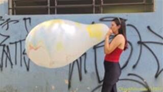 Laura Blows to Pop a 30-Inch Marble South American Balloon