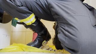 Firefighter taking off Boots and Socks after Stomp