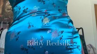 Wiggling into a tight teal cheongsam