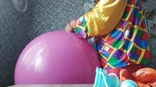 clown girl blowing big balloons